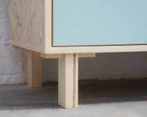 Credenza in mint green and vanilla laminate, pine wood, and OSB with recycled black door knobs by Atelier Antipode